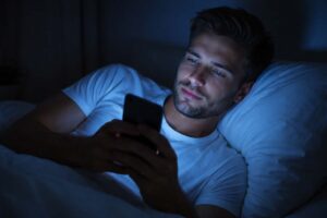 using phone before bed blue light affecting sleep quality at night